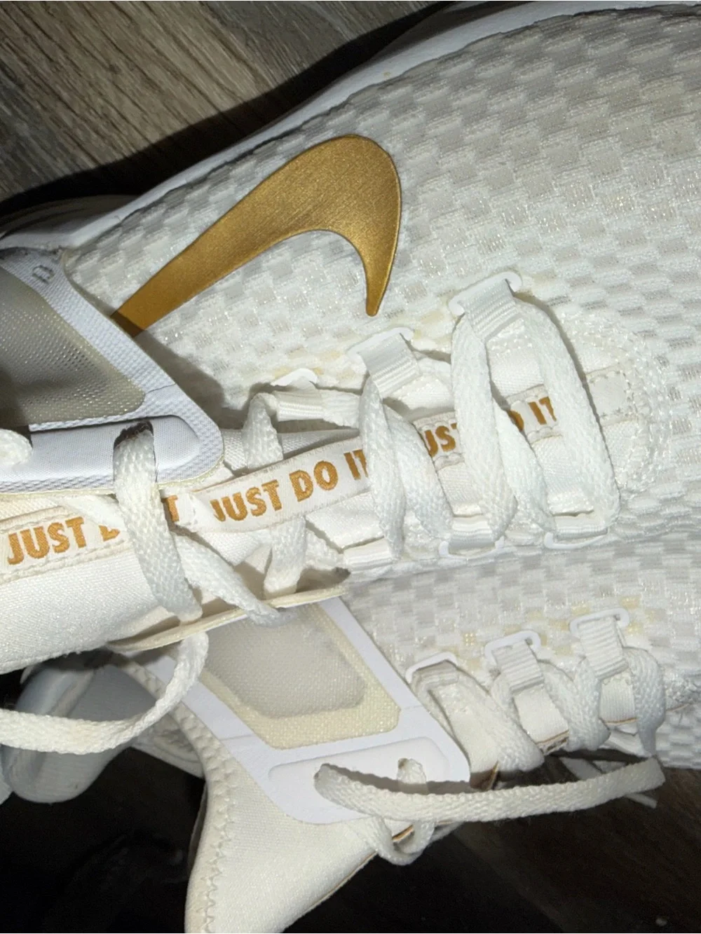 Nike Women's White Athletic Sneakers with Gold Swoosh